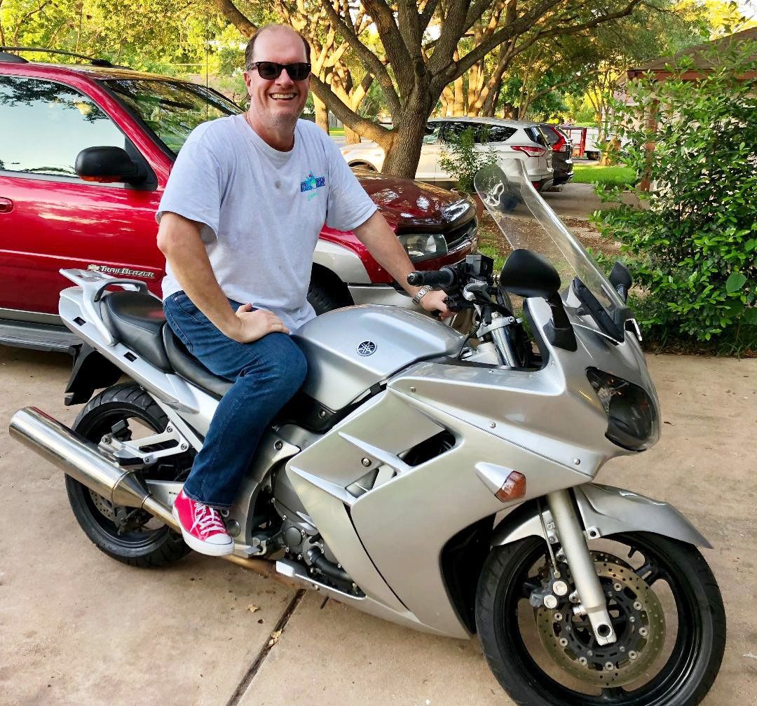 male client at the perfect workout on his motorcycle