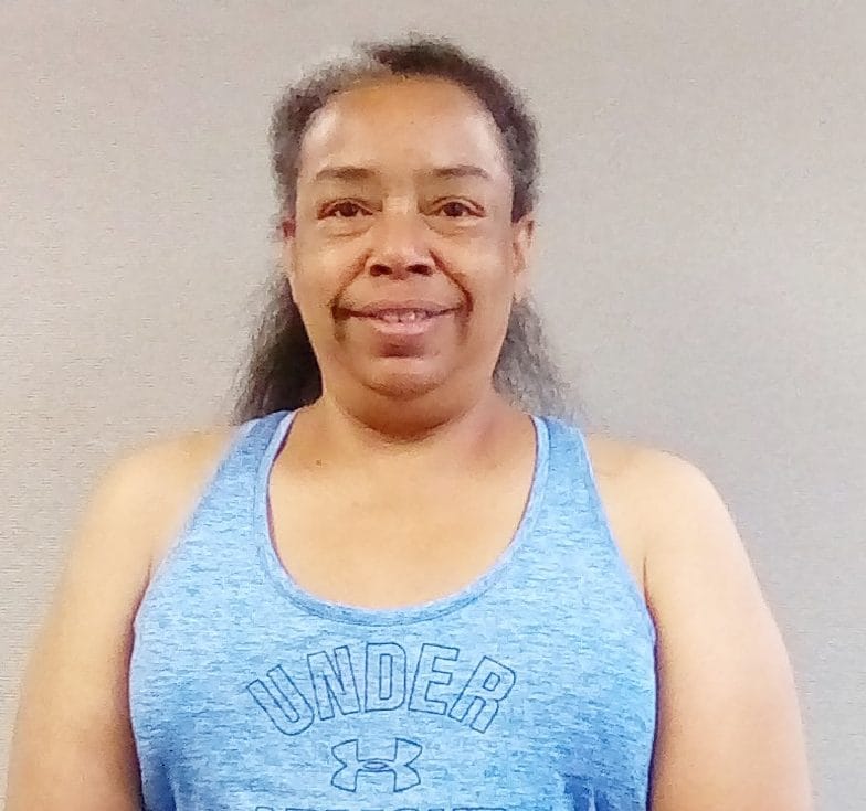 female client with the perfect workout smiling for the camera