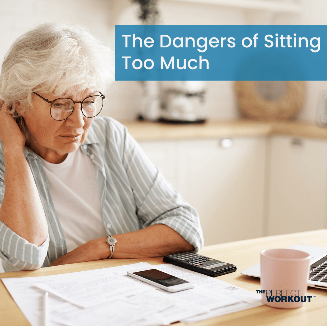 A woman experiencing pain from sitting at a desk for too long