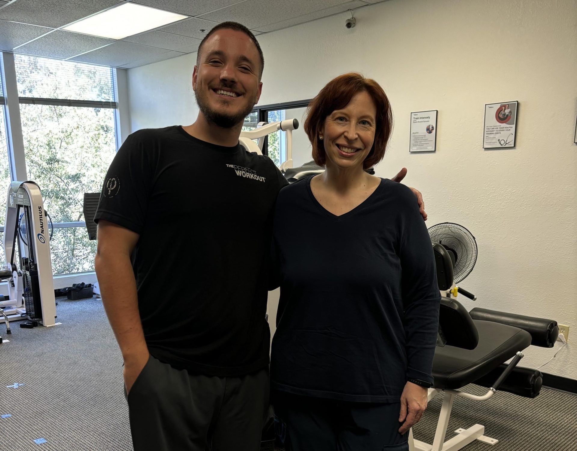 on the left is personal trainer Will from the san mateo studio and on the right is member Darcy