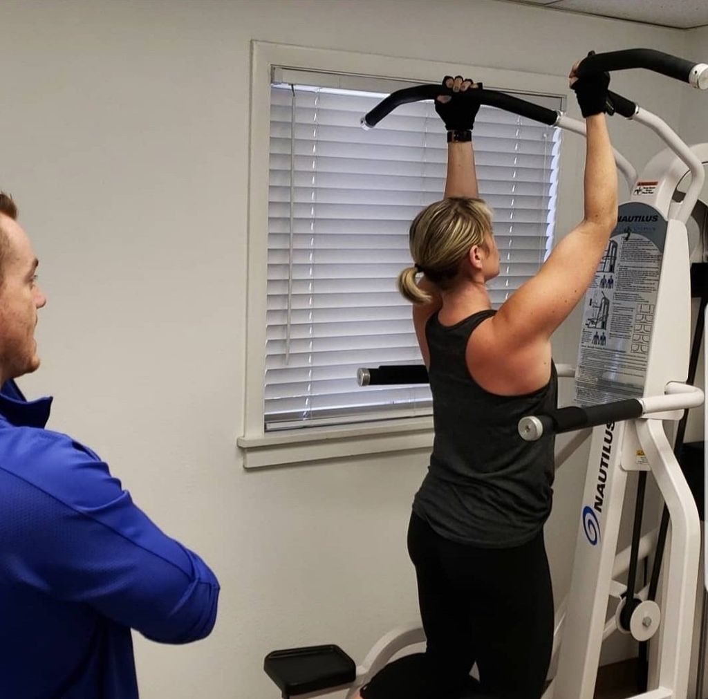 Female doing slow motion pull ups