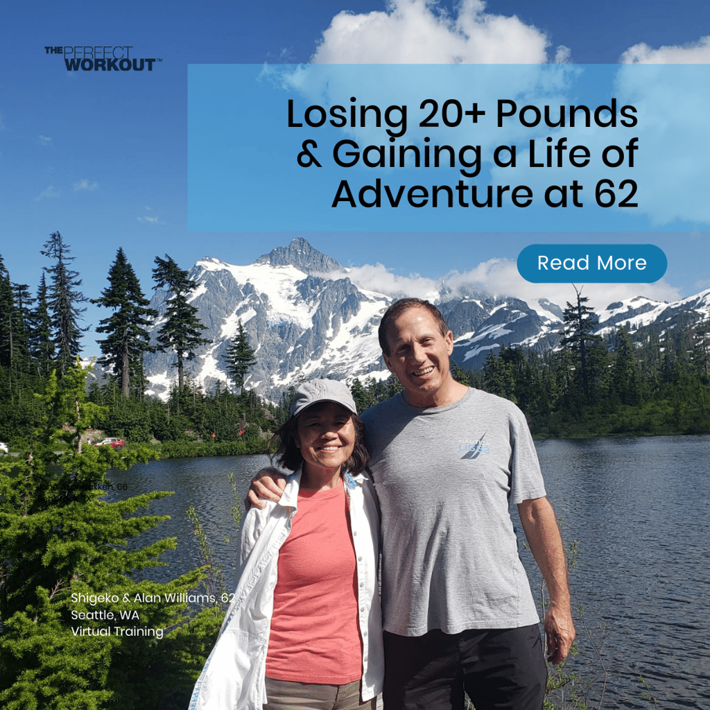 partners posing for a photo with mountains, a lake, and trees in the background