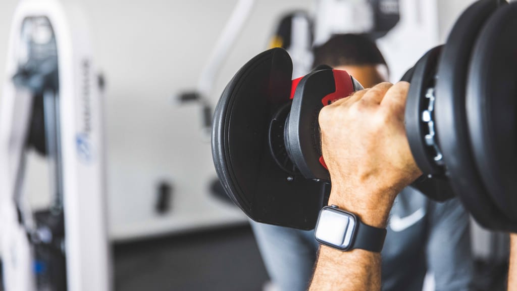 Man training with dumbbells