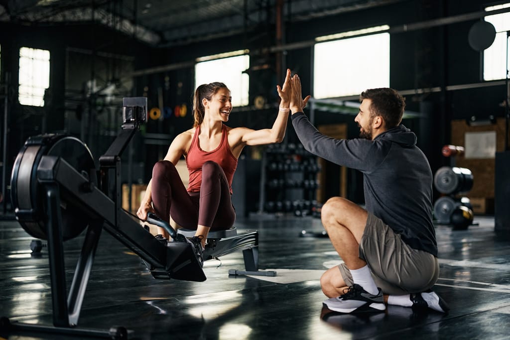 woman celebrating with a man after a cardio workout