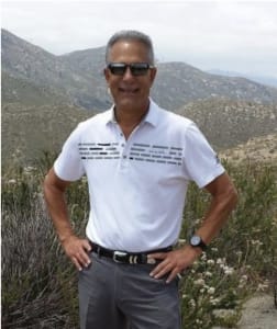 Male client standing proud and smiling outdoors