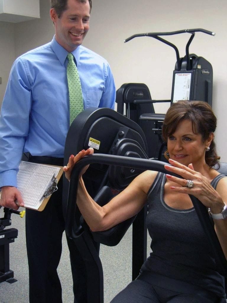 Matt Hedman coaching a female client at The Perfect Workout