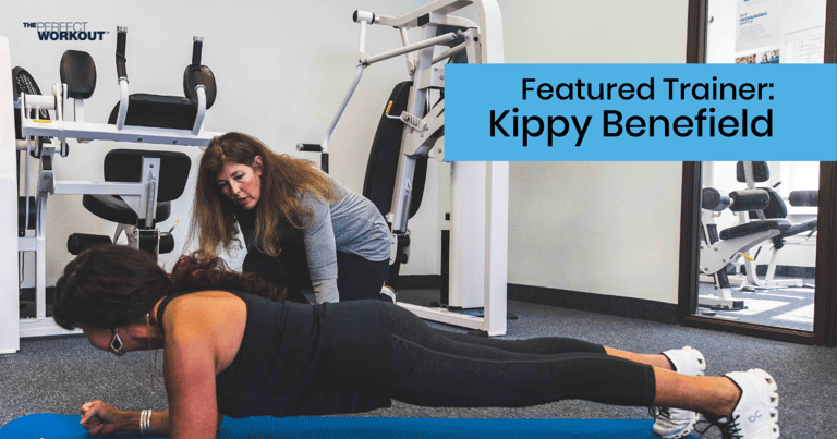 Female trainer helping female member with her plank form