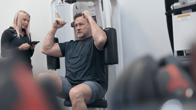 A man strength training at The Perfect Workout