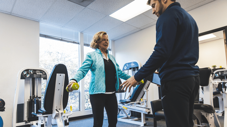 Image of PJ being coached by a trainer