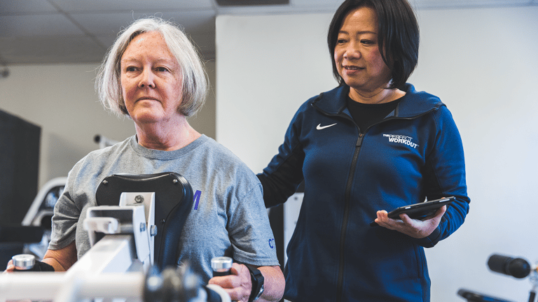 Image of Trainer, Merry, coaching Carelle on the compound row