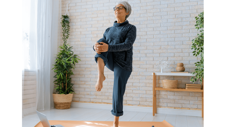 Senior woman practicing balance exercises