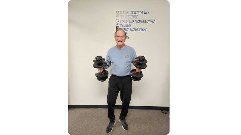 Bill showing off his strength from doing The Perfect Workout