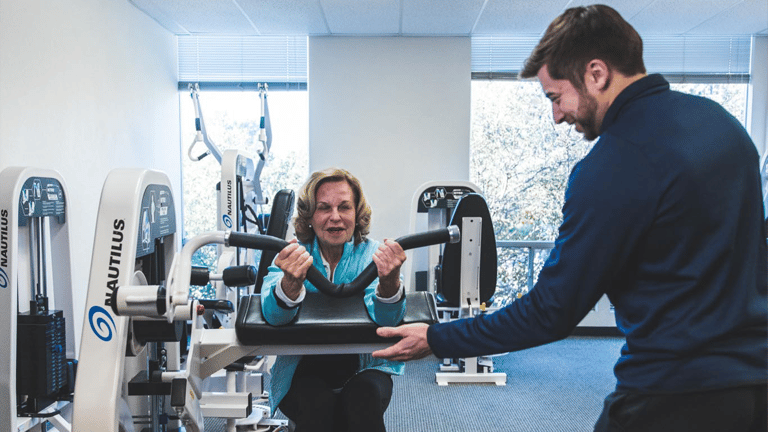 A woman who is fit and healthy from slow motion strength training that helps combat hight cortisol levels