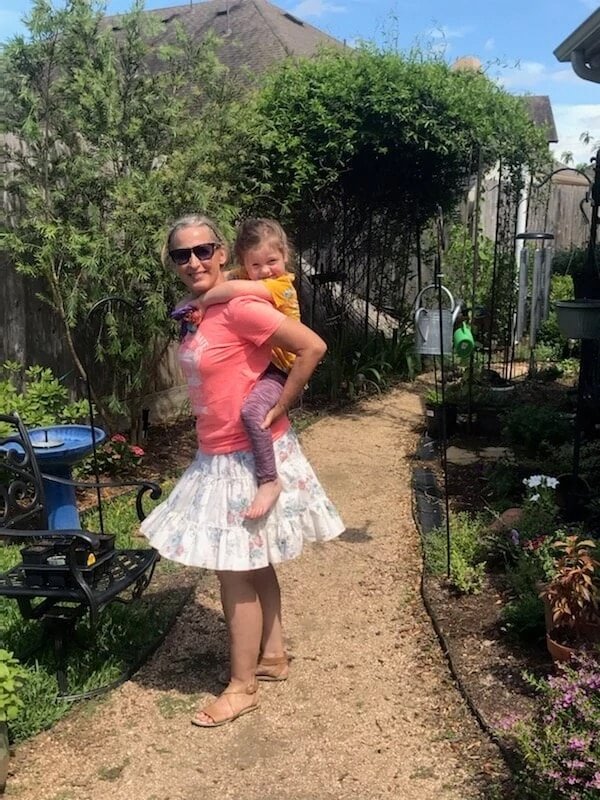 Female client with her daughter on her back