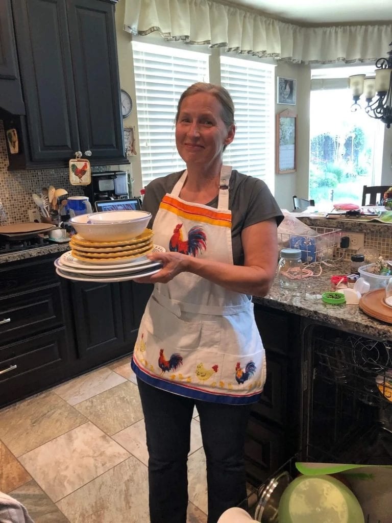 female client cooking in her kitchen