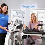 female CPT with client doing preacher curl