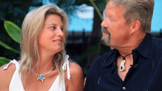 a fit couple in their 60's looking at each other