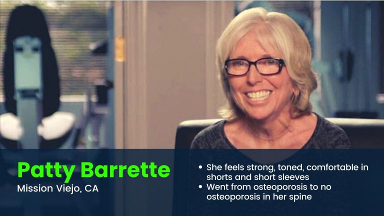 Woman smiling in studio because she feels strong and toned