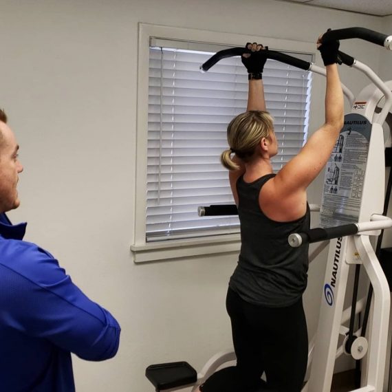 Female doing slow motion pull ups