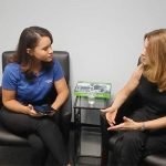 Female Personal Trainer giving a consultation to Female Client