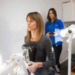 Female Personal Trainer With Female Client Working out