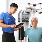 Male Personal Trainer and Male Client workout in studio