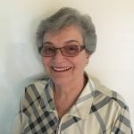 elderly female client smiling for the camera