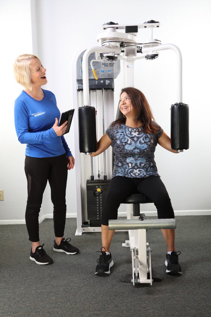 Female trainer with female client in studio