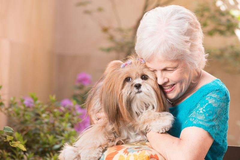 christine gandal virtual personal training client with her dog