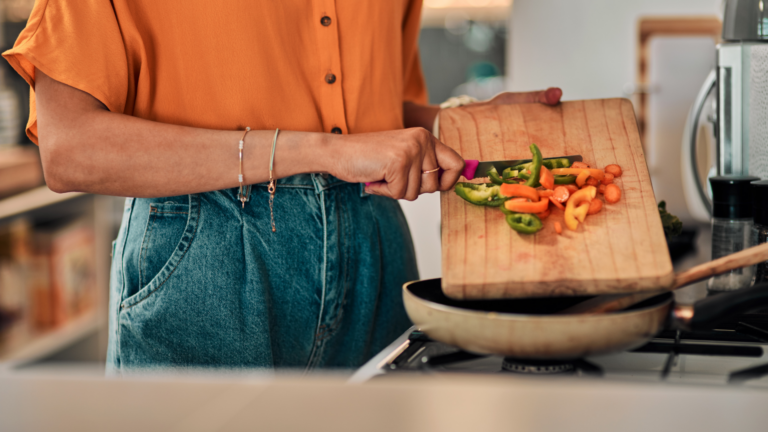 woman prepping food and creating healthy habits