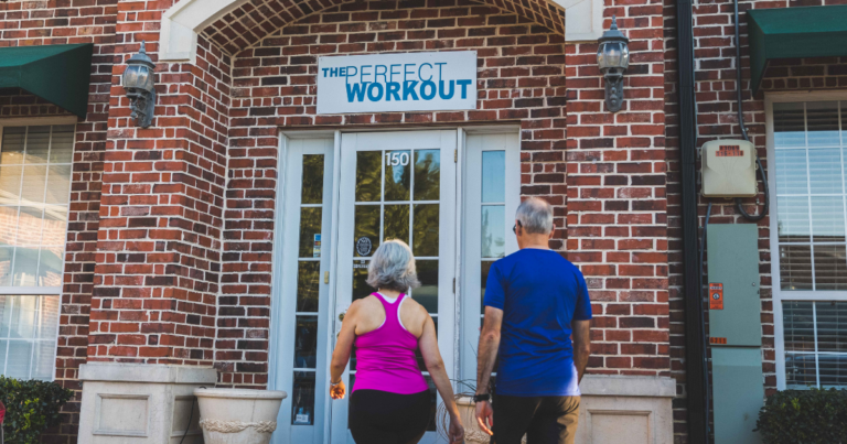Male and Female member walking into The Perfect Workout Studio