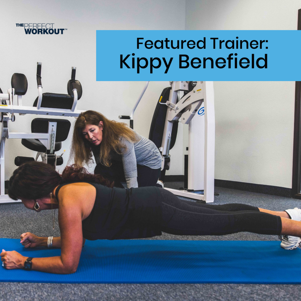 Female trainer coaching female member on how to do planks