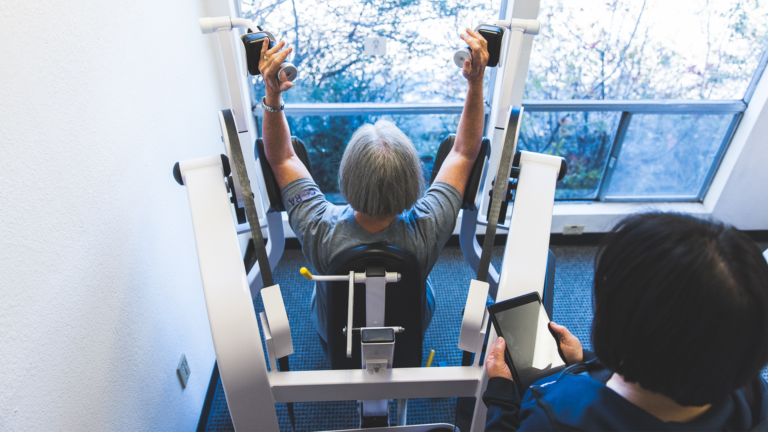 Image of member Carelle K using the triceps machine