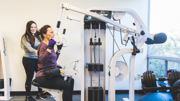 Image of female being coached by a trainer