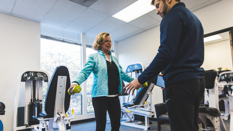 Image of PJ being coached by a trainer