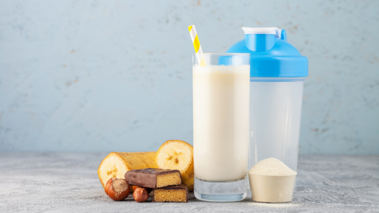 Protein shake, banana, protein powder, and protein bar