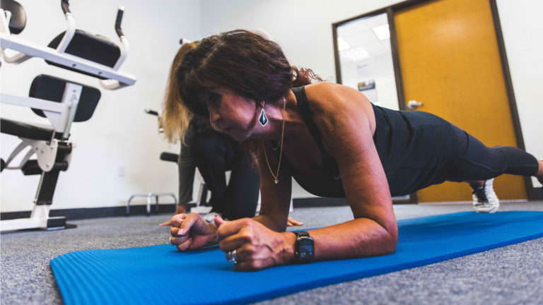 TPW Member, Teonie, improving her balance by practicing planks