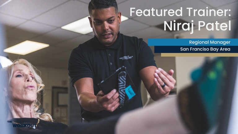 Image of Regional Manager Niraj Patel instructing a member on the leg press