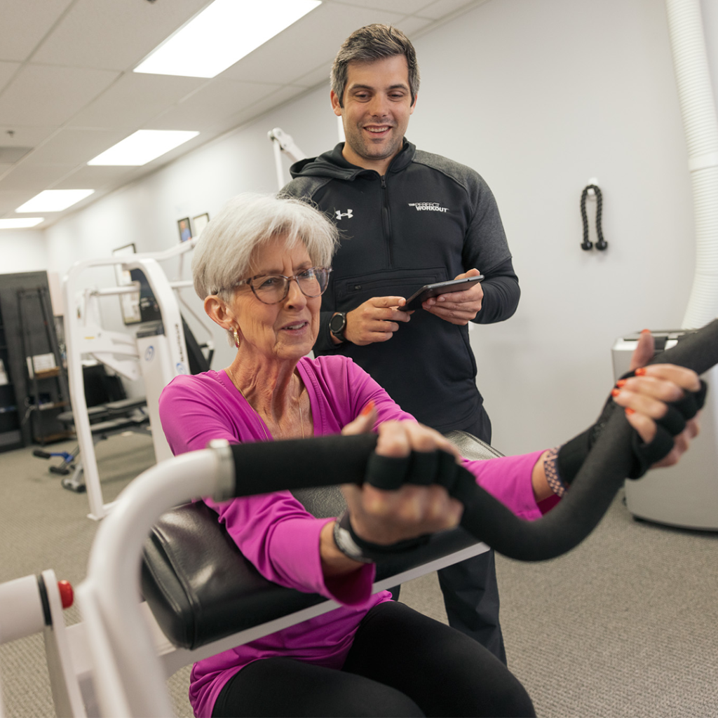 A woman being trained at The Perfect Workout