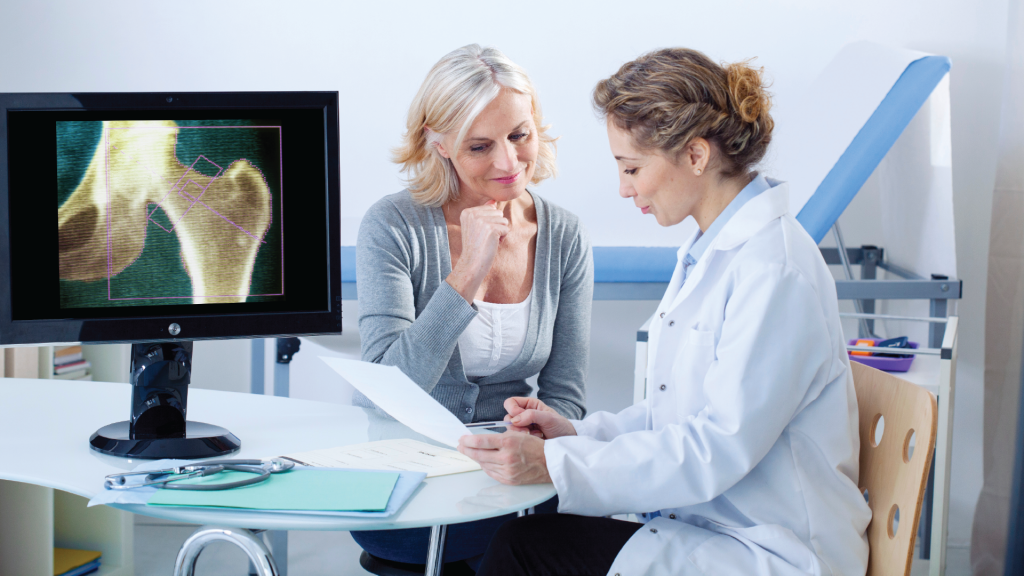 A doctor diagnosis a woman with osteoporosis