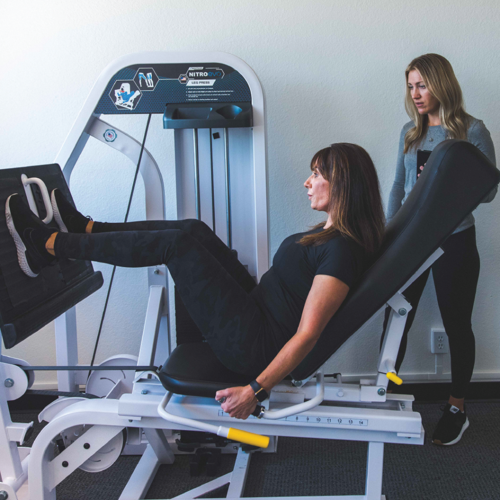 A woman strength training on the leg press