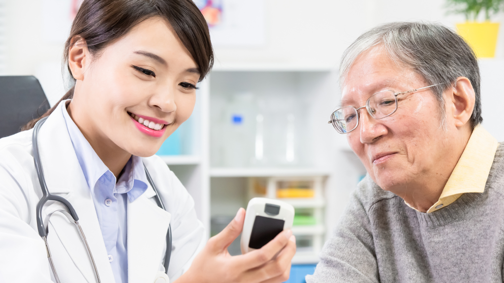 A doctor consulting their patient on their glucose levels